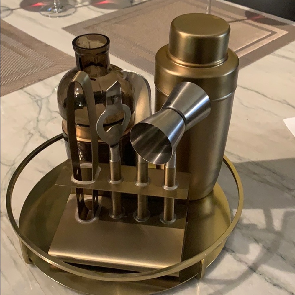Brass bar set with gold and purple vase
